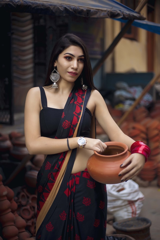 posing with a matka