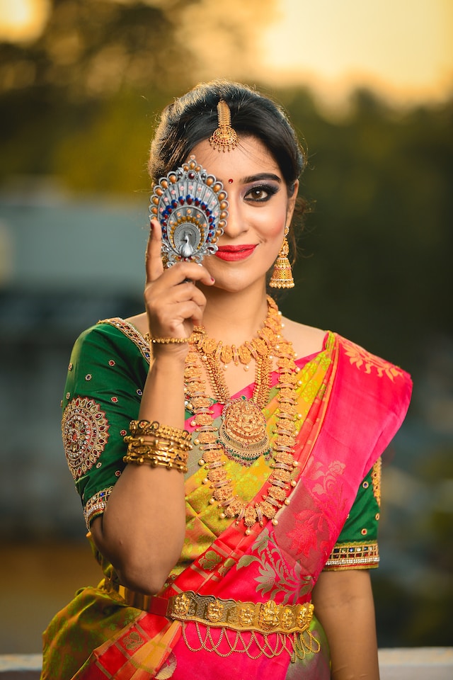Image of Indian traditional Beautiful Woman Wearing an traditional Saree  And Posing On The Outdoor With a Smile Face-SO401642-Picxy